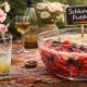 Runny fruit pudding in a glass bowl with cream and a small “Schlumpf Pudding” sign, illustrating how branding and presentation can change perception of a product